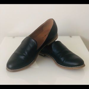 Black leather slip on shoes